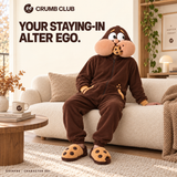 Goinfre design concept worn on a cream sofa with its sculpted hood and separate cookie slippers. Your staying-in alter ego.